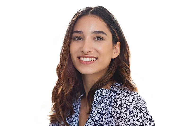 A young woman smiling with straight teeth