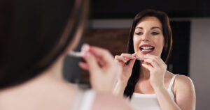 woman wearing her aligners before sleep